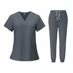 Gray medical uniform set with top and pants on a white background