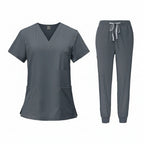 Gray medical uniform set with top and pants on a white background