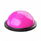 Pink balance dome with additional items on a white background