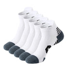Five pairs of white socks with gray toes and heels on a white background
