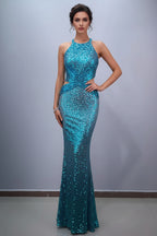 Teal sequin evening gown on a mannequin against a plain background