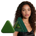 Woman with curly hair next to a triangle-shaped shampoo bar with branding.