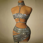 Silver beaded two-piece outfit on a mannequin against a beige background