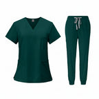Green medical uniform set with top and pants on a white background