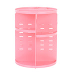 Pink cylindrical organizer with multiple compartments on a white background