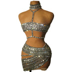 Silver beaded two-piece outfit on a mannequin against a beige background