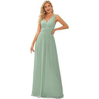 Woman wearing a light green evening gown on a white background