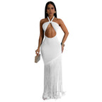 Woman wearing a white halter neck dress with fringe details on a white background