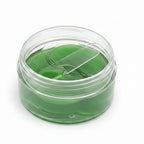 Aloe vera eye mask packaging with green aloe leaves and water droplets on a natural background.