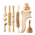 Set of wooden massage tools on a white background