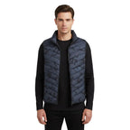 Black puffer vest on a white background