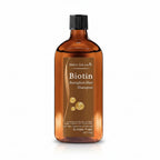 Biotin shampoo bottle and box with dimensions on a white background