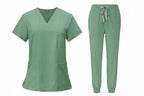 Green medical uniform set with top and pants on a white background