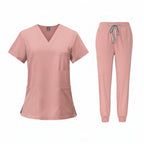 Pink medical uniform set with top and pants on a white background