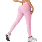 Person wearing pink leggings on a white background