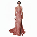Rose gold sequin one-shoulder evening gown with a high slit on a white background