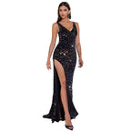 Woman in a black sequin dress standing in front of a white Mercedes-Benz G-Class SUV at night.
