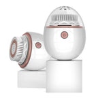 White and rose gold facial cleansing device on a white background
