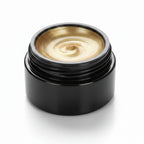 Gold nail gel being applied to nails with a brush