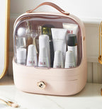 Pink cosmetic bag with skincare products including SK-II on a white surface.