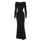 Black evening gown with long sleeves on a white background