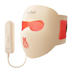 Beige facial mask with red accents and a handheld device on a white background