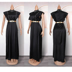 Black evening gown with gold belt on a mannequin against a white background