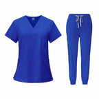 Blue medical uniform set with top and pants on a white background