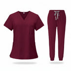 Maroon medical uniform set with top and pants on a white background