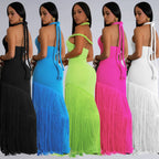 Five women wearing fringed dresses in black, blue, green, pink, and white.