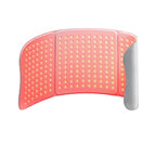 Red light therapy pad with US plug, cable, and packaging on a white background