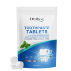 n eco-friendly standing pouch of ORALHOE Mint Breath-Freshening Toothpaste Tablets showing solid tablets and a bright smile.