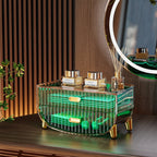 Decorative fragrance diffuser with Chanel branding on a wooden surface, featuring green and gold colors.