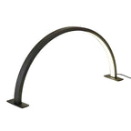 Modern arch-shaped table lamp on a neutral background