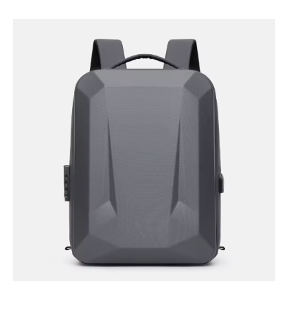 A dark gray geometric backpack with a textured finish, shown from the front against a light gray background.
