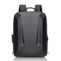 A matte black backpack with a geometric, faceted design, shown from the front on a white background with a subtle reflection.