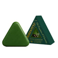 Green triangular shampoo bar with packaging on a white background
