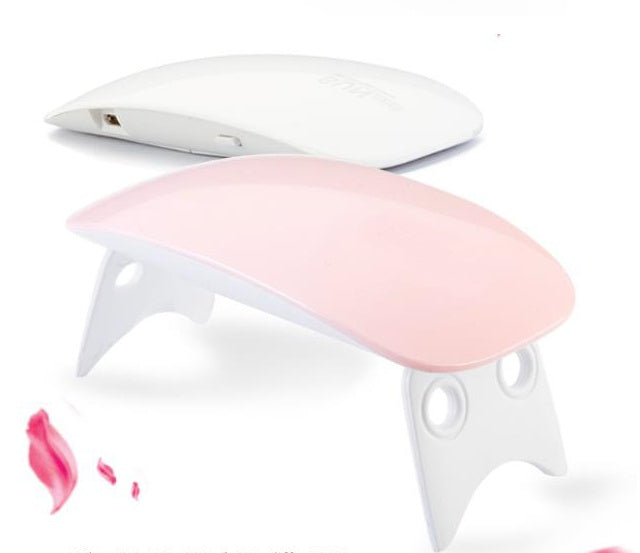 Pink and white electronic device on a white background