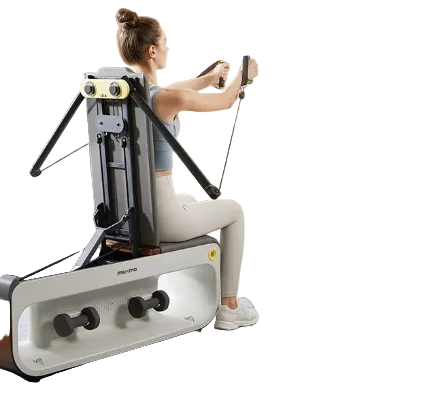 Woman using a rowing machine in a home setting