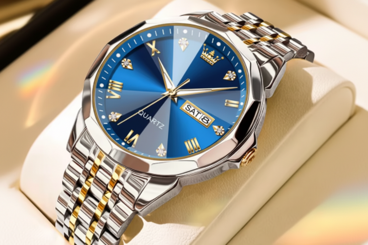 Olevs quartz wristwatch with a blue sunburst dial, silver and gold-tone metal case and link bracelet, shown on a beige display cushion. The red Olevs logo appears in the top-left corner.