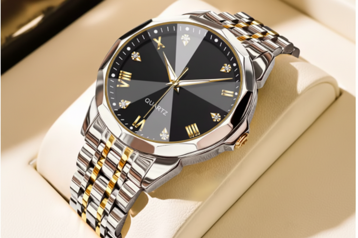 Olevs men's quartz watch with a black dial, gold-tone details, and a two-tone silver and gold stainless steel link bracelet, displayed on a beige watch cushion.