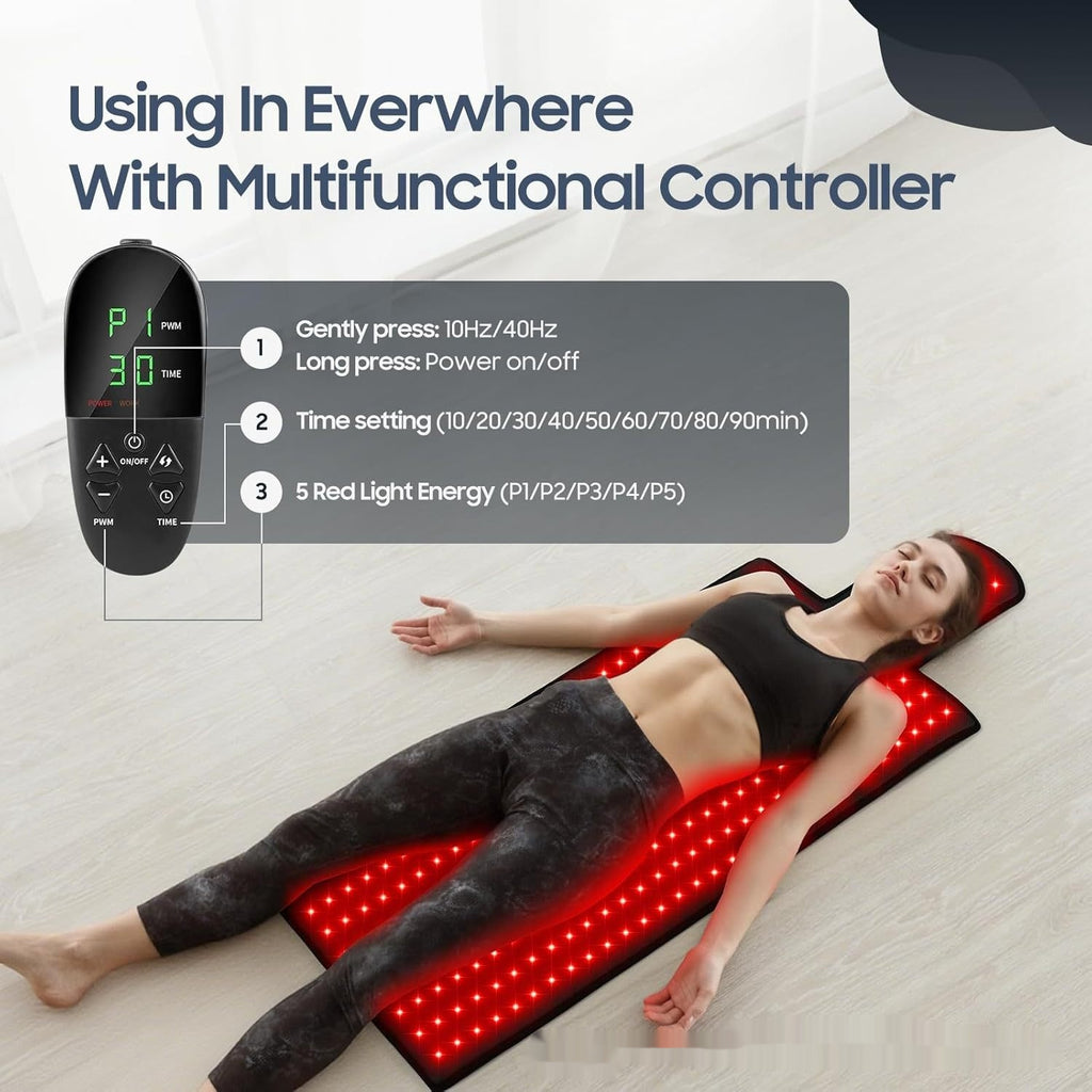 Person lying on a red light therapy mat with a multifunctional controller displayed.