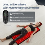 Person lying on a red light therapy mat with a multifunctional controller displayed.