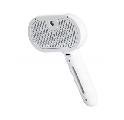 A white handheld pet grooming brush with a textured bristle head and a smooth handle, shown against a plain white background.