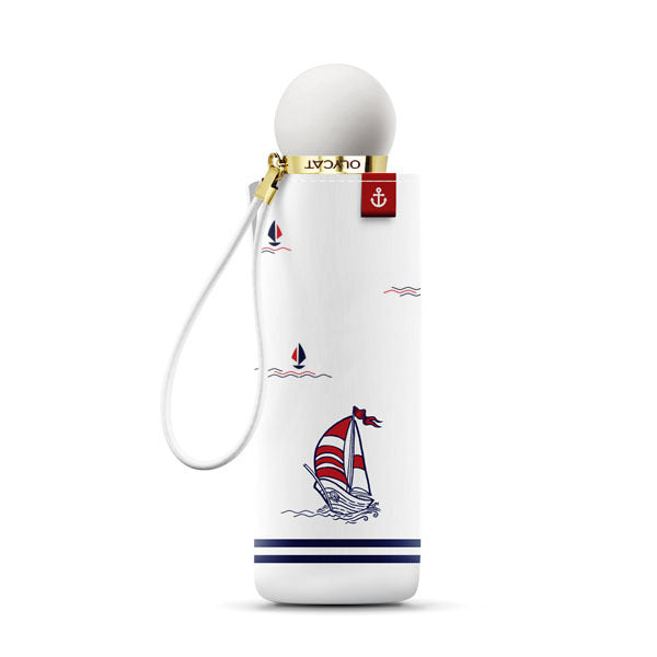 White umbrella with sailboat design on a white background