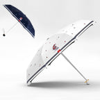 White umbrella with red and blue design on a white background