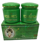 Two green jars with a box on a white background