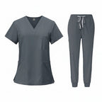 Gray medical uniform set with top and pants on a white background