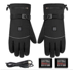 Pair of black heated gloves with charging cable and battery pack on a white background