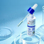 Disaar sunscreen serum bottle with dropper on a blue background